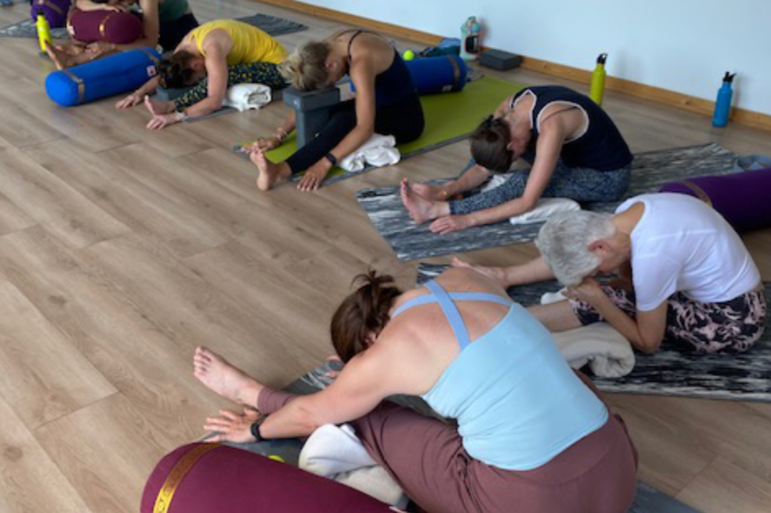 group of woman doing yoga